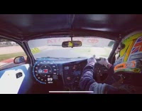 Race car driver competes on track 