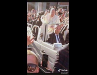 Guy drinks beer when pope drives by 
