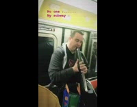 Man plays a sad song on a harmonica like instrument on the subway #BluePointWhatTheL
