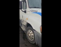 Man shows goose nest behind the truck