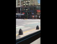 Man in jacket hoodie dances at street