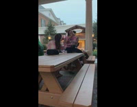 Pink shirt girl poses with turkey leg at DisneyWorld