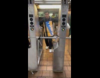 Guy on metrocard costume jumps over turnstile