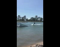 Wakeboarder lands off ramp on his back fail 