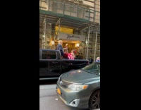 Woman mannequin leg spread in front of Trump