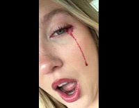 Womans tears turns red because of red mascara 