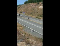 Girl stands in highway friends take pictures. You're dead