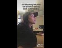 Girl black sweater brown hat on computer