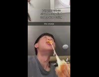 Guy keeps eating corndog cheese while girlfriend chokes
