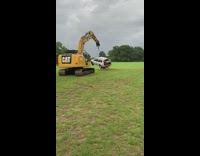 Construction vehicle swings guy in car around