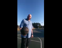 Guy makes basketball shot from across the court 