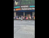 Woman white crop top tiktok dance Time Square