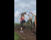 Lady poses with feral chimp