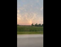 Man shows double stream rainbow while driving