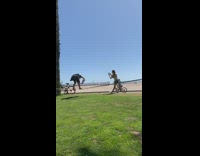 Guy holds blm sign slackline beach protest