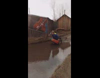 Guy falls off tube into mud water 