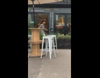 Man gray checkered coat dance music video