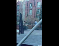 Lady wears black bathing suit fur hat