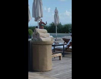 Woman bikini sing selfie beside pool towels