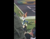 Woman number 90 jersey shirt photo shoot side football field