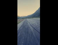 Guy wheelie on red dirt bike motorcycle 