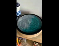 Man Draws Turtle on Sand with Ball