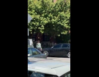 Woman tries to fix her car bumper