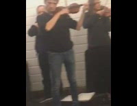 Orchestra in subway violin man sitting on stairs crying cover mouth