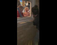 Girl scares baby boy in house 