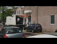 Truck unload clothes like rollercoaster towards store