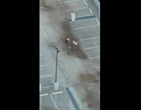 Girl green pants rooftop friends hold LED