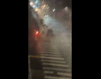 Collab WINY - People cross the street during storm night