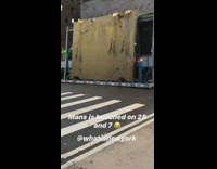 Giant truck gets stuck in road