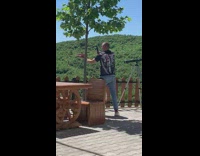 Man hold food plate on balcony for a picture