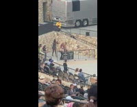 Woman bend over show butt amphitheater fence