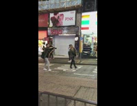 Girl walks down street for video night