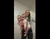 Woman holding two massive chunky babies