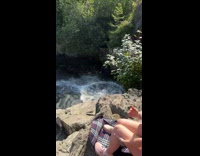 Man shirtless do a backflip from bridge