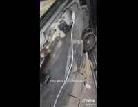 Car door opens with white charger cord 