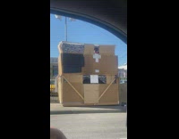 Homeless man on second floor of cardboard condo