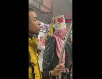 Red heart hat necklace sign activist