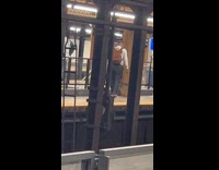 Man sings in the subway with his guitar