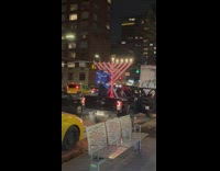 Man dances behind a pick up truck 