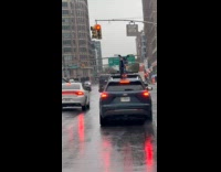 Man shows car transport bike on roof