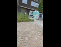 Girl squats poses large blue gift box