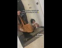 Kid Sits and Blocks Out Dad from Door