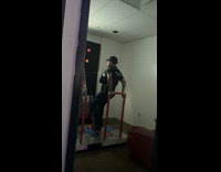 Cop playing dance revolution at arcade