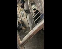 Guy in sweatsuit on subway practicing boxing