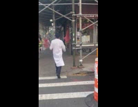 Patrick Starfish hold bag walking on sidewalk