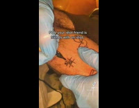 Tic tac toe tattoo game on arm 